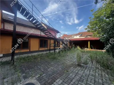 De inchiriat spatiu comercial/casa individuala cu 10 camere si teren de 600 mp in zona Piata Cluj din Sibiu - Sibiu
