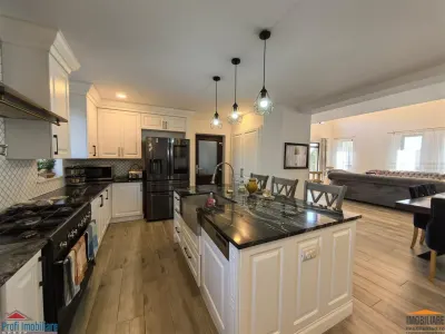 Vila impunatoare cu 6 camere spatioase in stil american - foto 4