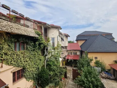 Casa familiala cu spatiu comercial si garaj P+1E+M 720 Mp - foto 4